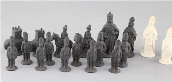 A Castleford type biscuit porcelain and basalt chess set, kings 3.25in.